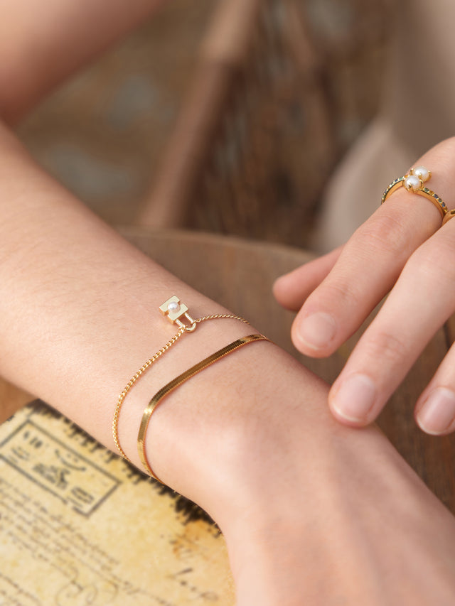 Gold and Pearl modern Muse Padlock Bracelet